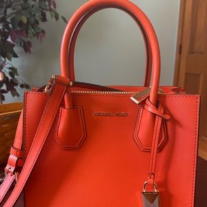 Brand new tangerine Michael Kors handbag.